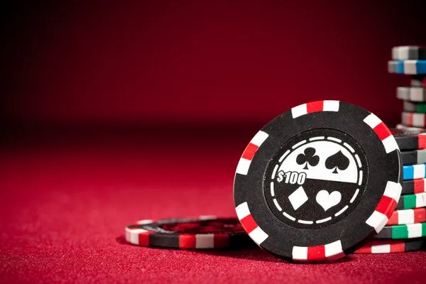 Live dealer managing cards and payouts